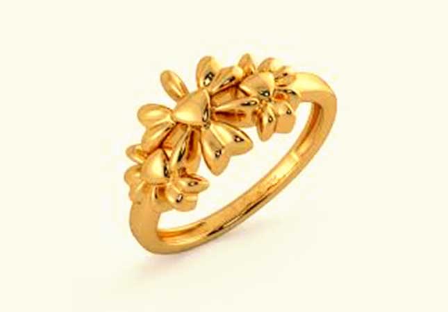 Gold ring with flower design