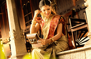 Woman wearing gold ornaments Woman wearing gold ornaments
