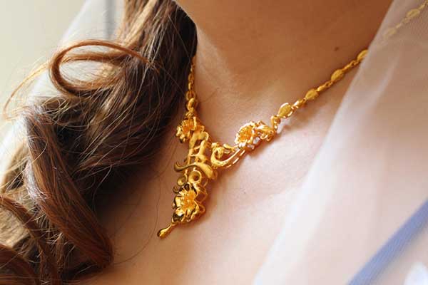 Woman wearing gold jewellery