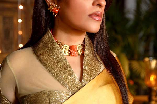 Woman wearing gold jewellery