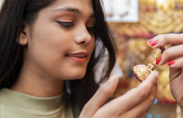 woman buying gold jewellery
