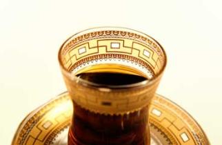 A bowl of sandwich gold glass with a floral design in gold leaf