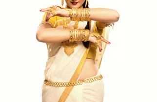 Woman adorning traditional gold waist-belt