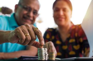 old couple with coin stack