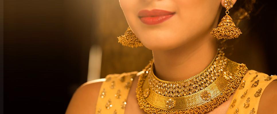 Woman wearing traditional gold necklace and earnings