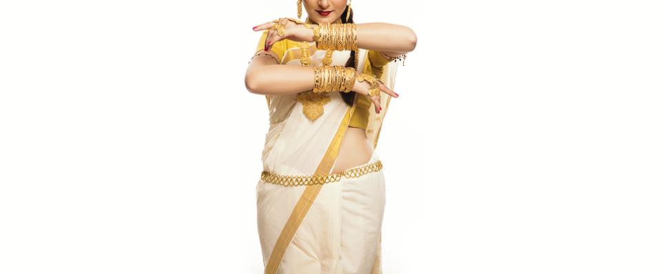 Woman adorning traditional gold waist-belt