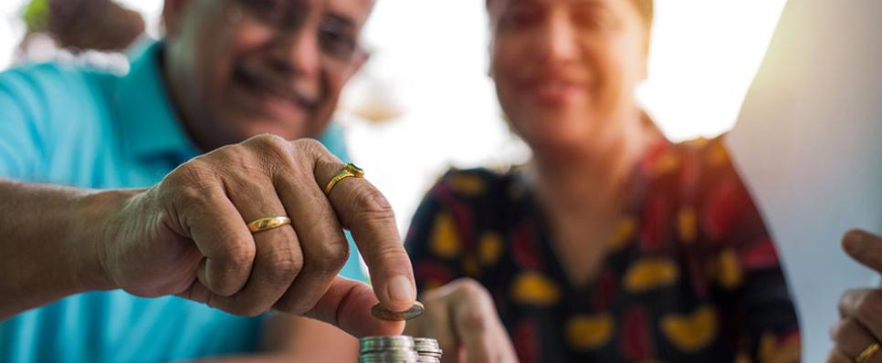 old couple with coin stack