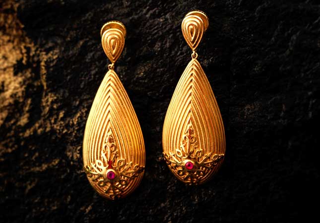 Stylish tribal gold earring piece